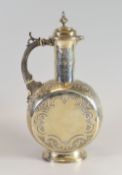 A SILVER LIDDED WINE EWER IN THE PERSIAN STYLE with circular moon-flask body raised over a