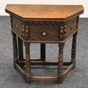 A CARVED ANTIQUE-REPRODUCTION HALF MOON HALL TABLE with foldover top and centre drawer
