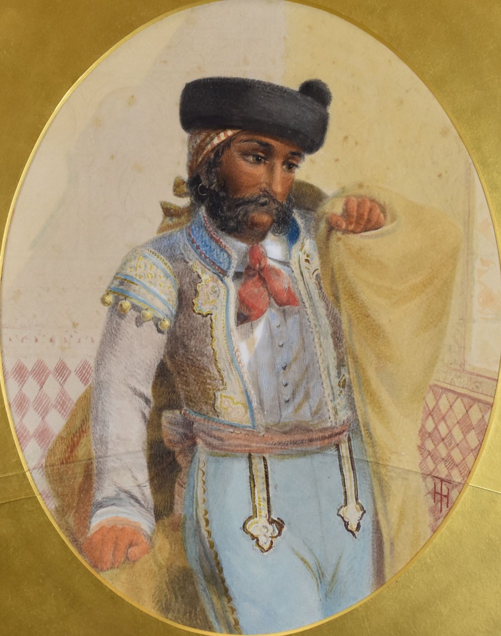 NINETEENTH CENTURY SCHOOL oval watercolour - standing portrait of a figure, possibly a matador,