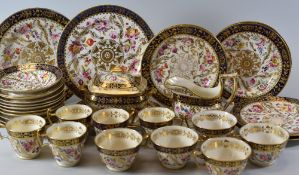 AN EXTENSIVE NINETEENTH CENTURY TEA-SET profusely decorated with flowers and gilding within a