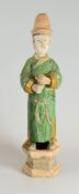 A TERRACOTTA MALE MING COURT OFFICIAL stood on an hexagonal base (please take car when handling -