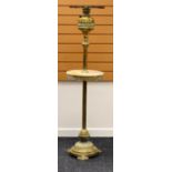 A TURN OF THE CENTURY BRASS STANDARD OIL LAMP on a circular base and with marble shelf
