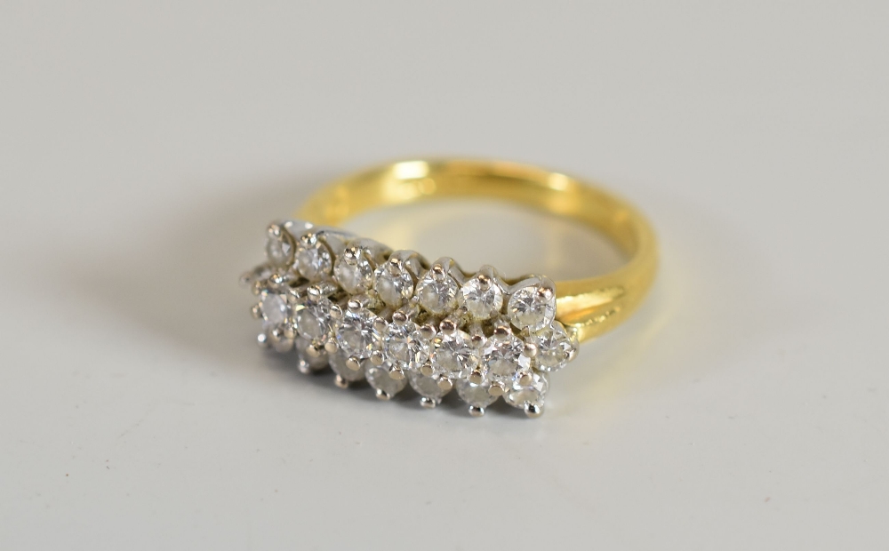 AN 18CT YELLOW GOLD & DIAMOND CLUSTER RING of twenty-two diamonds in three rows, 4.5gms