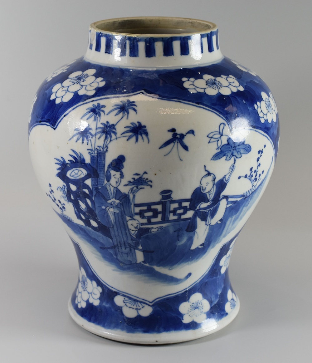 A NINETEENTH CENTURY CHINESE JAR prunus decorated with two shaped panels of courtesan scenes, four