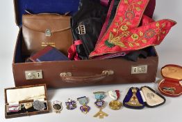 A MASONIC CASE & CONTENTS including ceremonial aprons, booklets and medals (medals have been