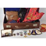 A MASONIC CASE & CONTENTS including ceremonial aprons, booklets and medals (medals have been