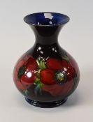 A MOORCROFT ANEMONE VASE of onion-shape and the body with a continuous row of flambe glazed anemones