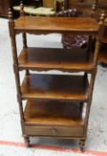 A LATE VICTORIAN MAHOGANY WHATNOT with four shelves and base drawer