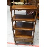 A LATE VICTORIAN MAHOGANY WHATNOT with four shelves and base drawer