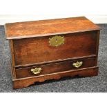 AN OAK COFFER BACH circa 1780/1800 having a single base drawer and lidded top with brass