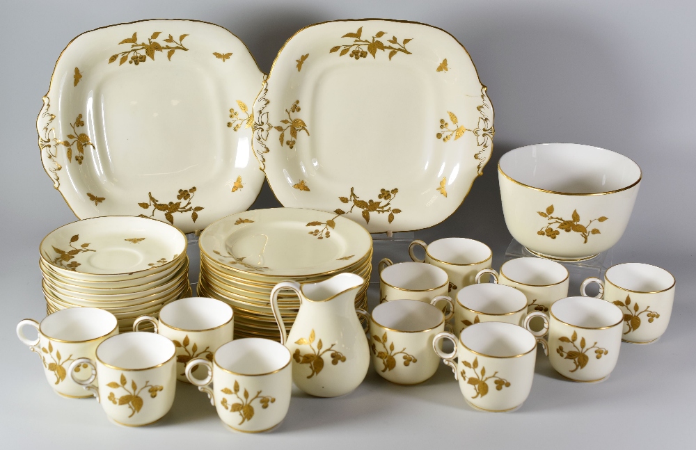 A FORTY PIECE DAVENPORT COFFEE SERVICE decorated with gilded branches of berries to an ivory ground,