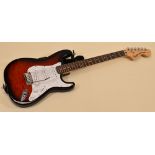 A SQUIER STRATOCASTER BY FENDER red with pearl effect scratchplate, serial number IC040736007, 99cms