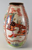 A JAPANESE ENAMELLED CERAMIC VASE decorated with two panels of climbing plants and two panels of