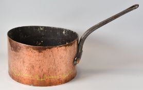 A LARGE ANTIQUE COPPER SAUCE PAN with long iron looped handle, 32cms diam x 17cms high