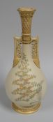 A ROYAL WORCESTER TWIN HANDLED VASE with narrow neck and openwork to the neck and handles on a