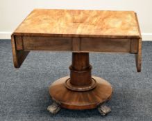 WILLIAM IV MAHOGANY DROP FLAP SOFA-TABLE having a substantial circular and columnal base with four