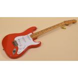 A FENDER STRATOCASTER in red with white scratchplate, signed Hank Marvin together with another