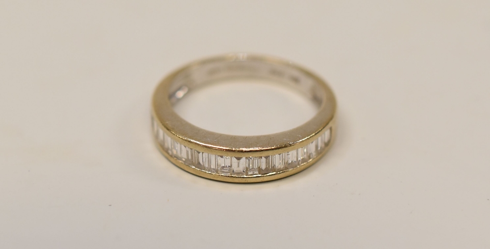 A MODERN HALF-HOOP DIAMOND & 18K WHITE GOLD ETERNITY RING with a single row of baguette diamonds, - Image 2 of 2