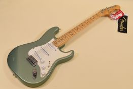 A FENDER STRATOCASTER ELECTRIC GUITAR sage green with white scratchplate in carry case, serial