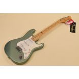 A FENDER STRATOCASTER ELECTRIC GUITAR sage green with white scratchplate in carry case, serial