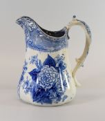 AN YNYSMEUDWY POTTERY JUG in blue and white with floral decoration, 16cms high
