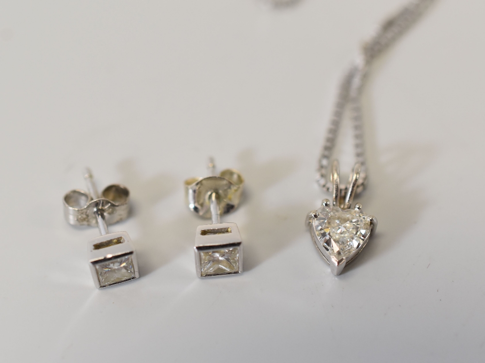 A HEART-SHAPED DIAMOND PENDANT & PAIR OF SQUARE DIAMOND STUD EARRINGS on a 9ct white gold fine
