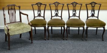 A SET OF FOUR EDWARDIAN CARVED BACK DRAWING ROOM CHAIRS with stuff over upholstered seats together