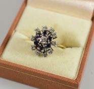 A DIAMOND & SAPPHIRE ABSTRACT RING set in 18ct yellow gold, 5gms