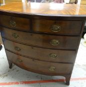 A BOW FRONT MAHOGANY CHEST of three long and two short drawers