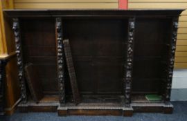 A LARGE CARVED BREAK-FRONT OPEN BOOKCASE, 160cms high x 250cms wide