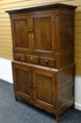 A GOOD NINETEENTH CENTURY WELSH OAK PRESS CUPBOARD OF SMALL PROPORTIONS composed of a two-door