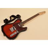 A SQUIER TELECASTER ELECTRIC GUITAR in rose coloured wood with contrasting scratchplate together