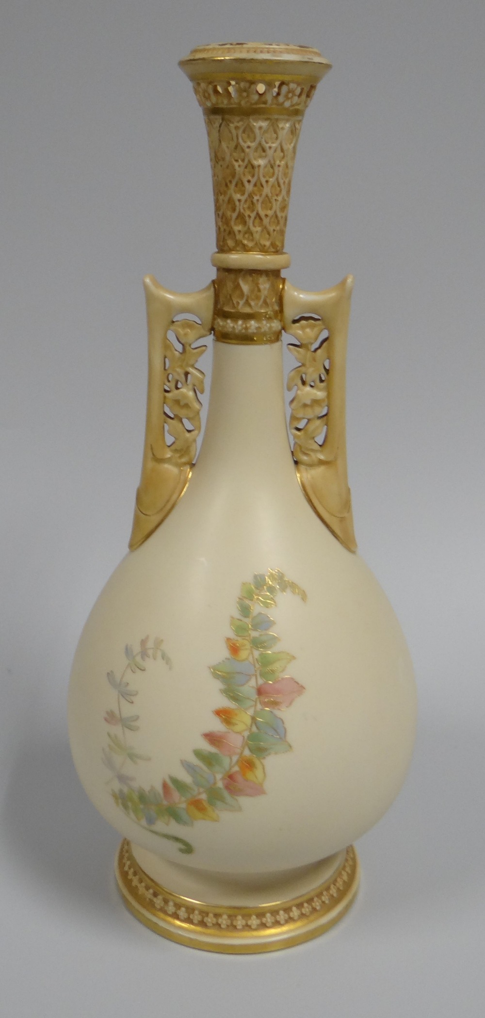 A ROYAL WORCESTER TWIN HANDLED VASE with narrow neck and openwork to the neck and handles on a - Image 2 of 2