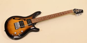 A TANGLEWOOD TOMKAT ELECTRIC GUITAR in light and dark contrast wood, 90cms long