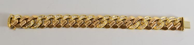 AN 18CT YELLOW GOLD & DIAMOND GENT'S BRACELET of multiple links and marked 750 and 'GARRARD',