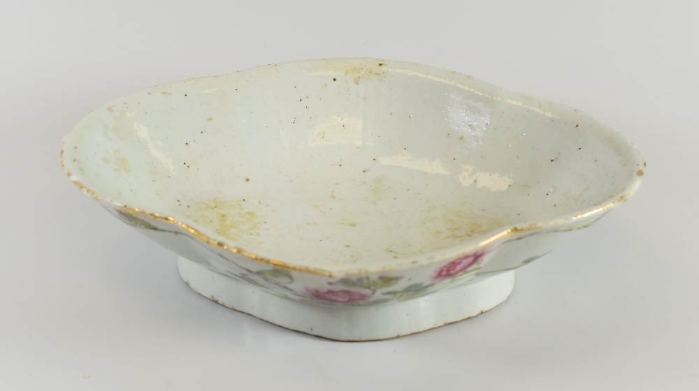 A CHINESE FAMILLE ROSE DISH decorated with roses and Chinese inscription to the obverse and of