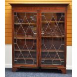 A NINETEENTH CENTURY MAHOGANY BOOKCASE CUPBOARD-TOP with two astragal glazed doors on later