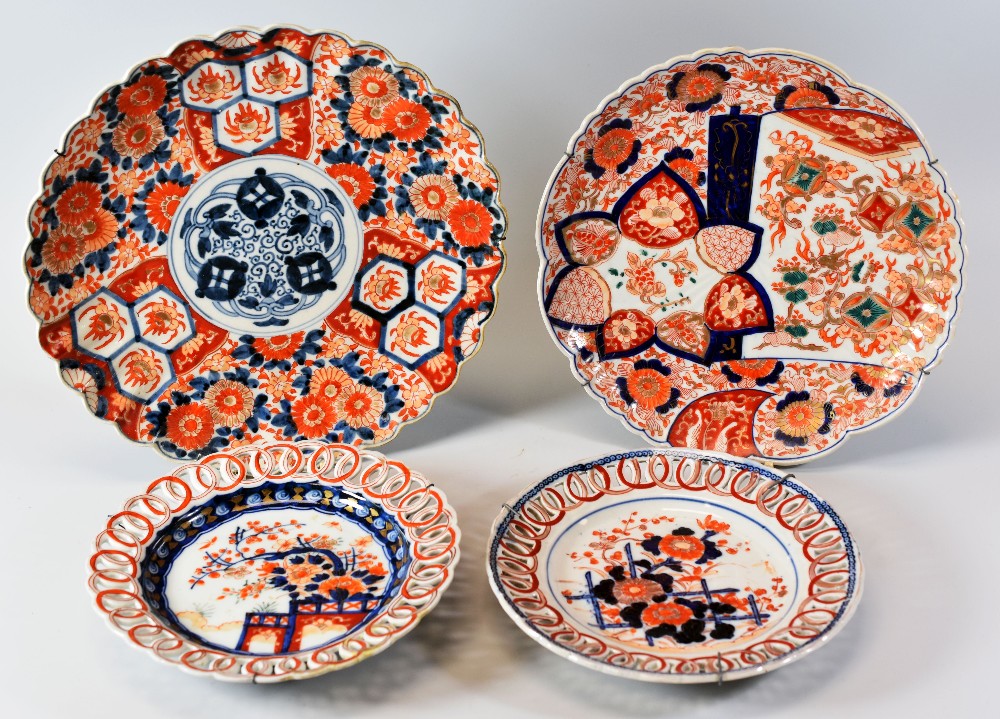 FOUR ITEMS OF JAPANESE IMARI comprising two near matching ribbon plates and two lobed chargers,