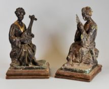 A PAIR OF JAPANESE BRONZE MUSICIAN FIGURES seated and on wooden bases, 23cms high