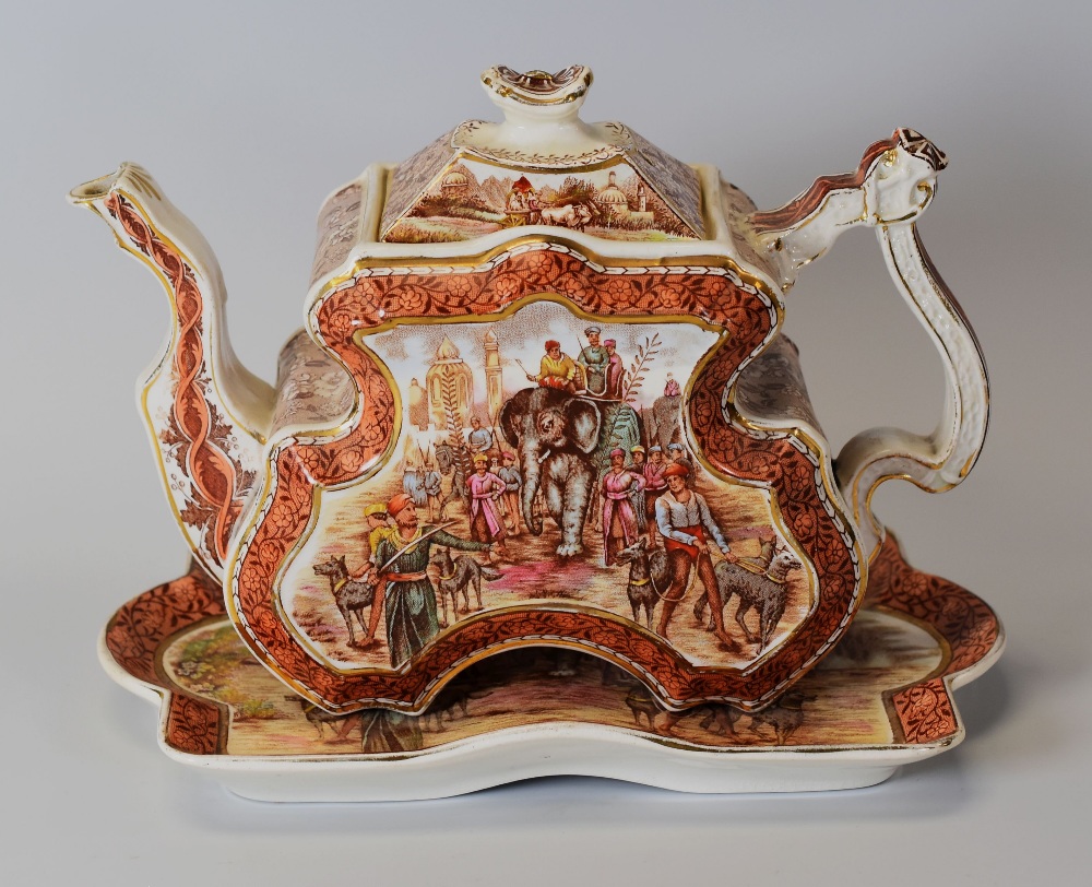A RARE BURGESS & LEIGH TEAPOT & STAND of elaborate aesthetic form and decorated with Indian Empire