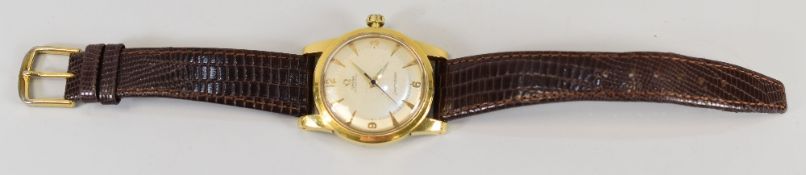 A VINTAGE OMEGA SEAMASTER GENT'S WRISTWATCH having an automatic mechanism within a yellow metal case