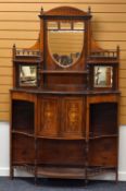 AN EDWARDIAN ROSEWOOD CABINET SIDEBOARD of serpentine form with centre two-door cupboard, and with