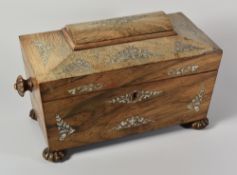 A GEORGIAN ROSEWOOD TEA-CADDY of sarcophagus form and having mother-of-pearl floral decoration,