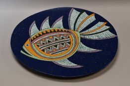 A LARGE CONTEMPORARY POTTERY CHARGER with a stylized fish in colourful glazes on a blue