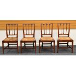 A SET OF FOUR FRUIT WOOD CHAIRS in the farmhouse-style with rush seats