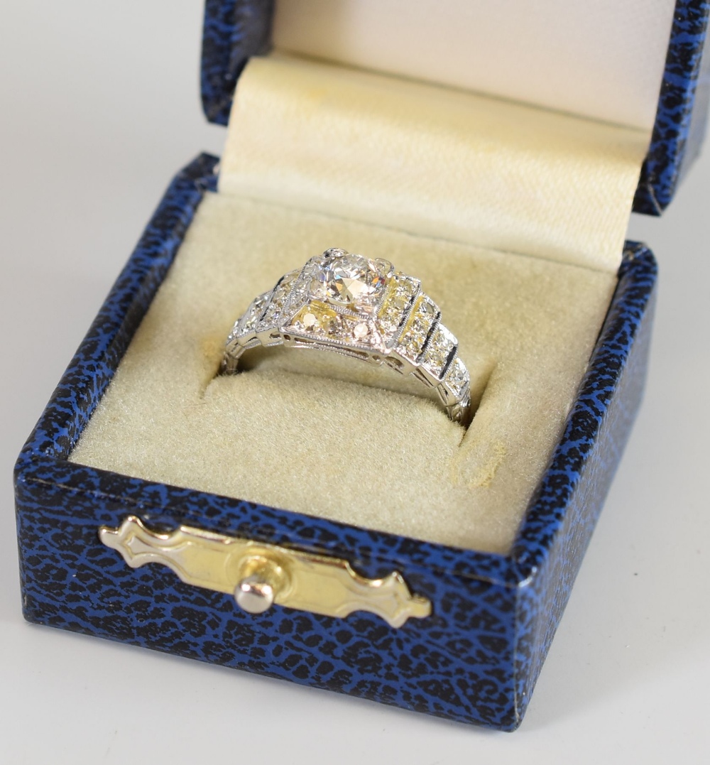 A PLATINUM ART DECO DIAMOND RING with stepped mount, the centre raised diamond 0.55cts approx ( - Image 2 of 3