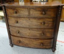 A VICTORIAN MAHOGANY CHEST of three long and two short drawers with fluted half column flanks on bun