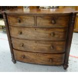 A VICTORIAN MAHOGANY CHEST of three long and two short drawers with fluted half column flanks on bun