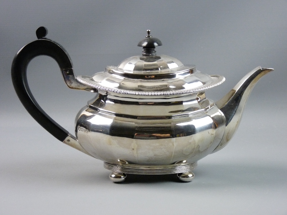 A CHESTER HALLMARKED SILVER TEAPOT of segmented form with reeded rim decoration and banded base on