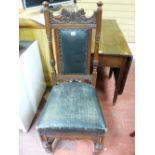 A CIRCA 1900 CARVED WALNUT SIDE CHAIR, the fancy top rail over a padded panel back, flanking